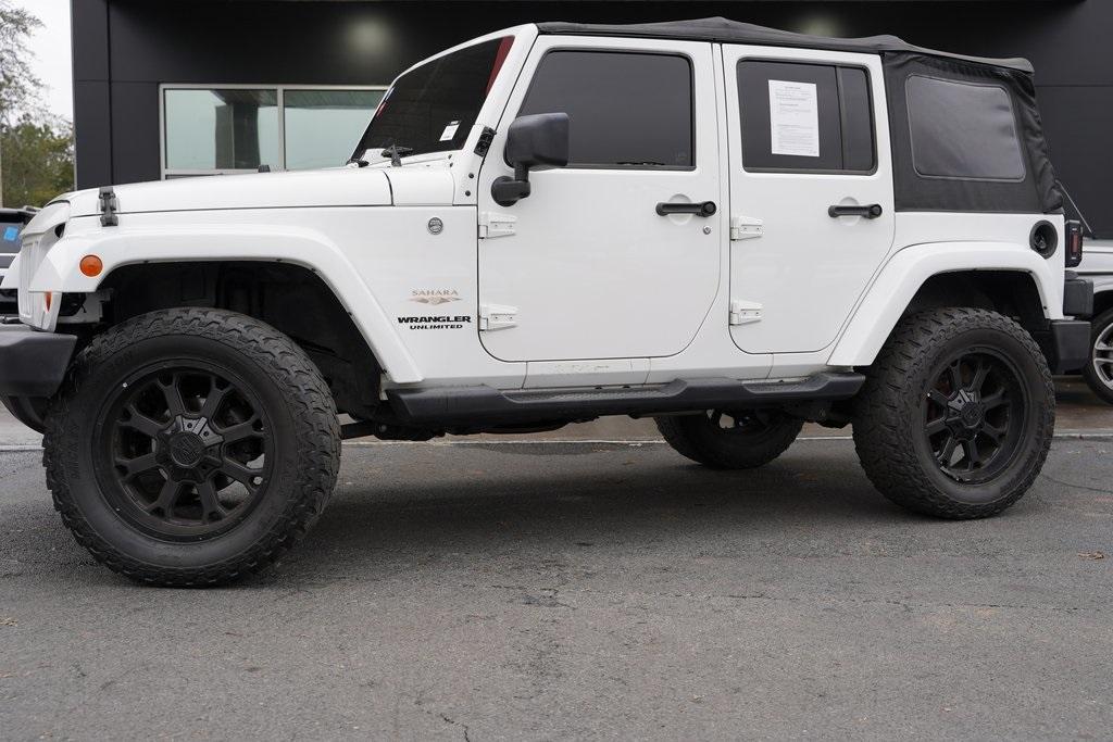 Used 2013 Jeep Wrangler Unlimited Sahara for sale Sold at Gravity Autos Roswell in Roswell GA 30076 2