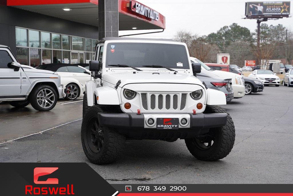 Used 2013 Jeep Wrangler Unlimited Sahara for sale Sold at Gravity Autos Roswell in Roswell GA 30076 1