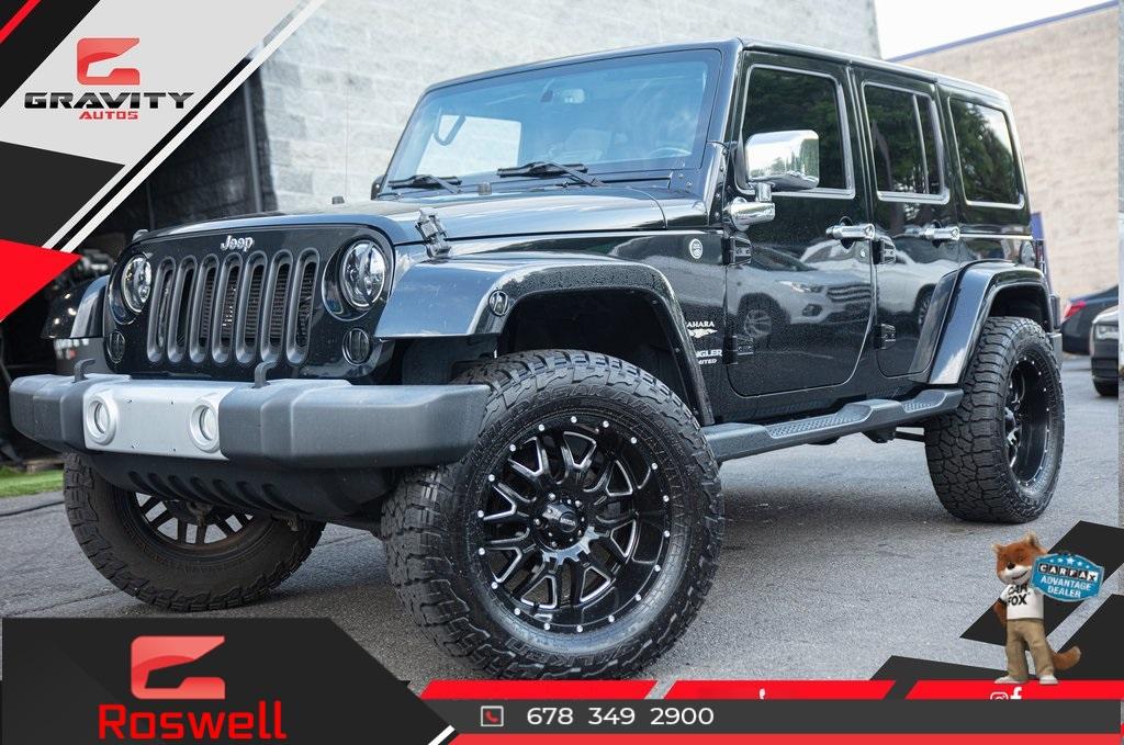 Used 2015 Jeep Wrangler Unlimited Sahara for sale $32,994 at Gravity Autos Roswell in Roswell GA 30076 1