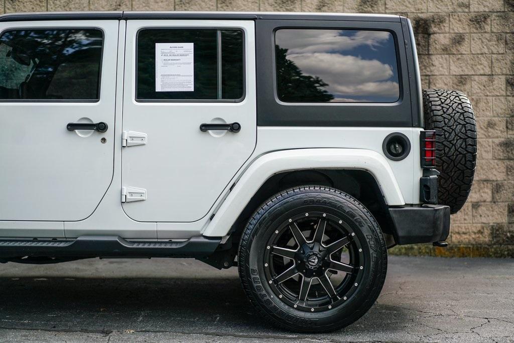 Used 2016 Jeep Wrangler Unlimited Sahara for sale $35,991 at Gravity Autos Roswell in Roswell GA 30076 10