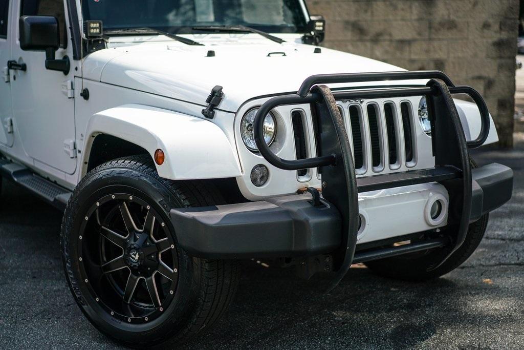 Used 2016 Jeep Wrangler Unlimited Sahara for sale $35,991 at Gravity Autos Roswell in Roswell GA 30076 6