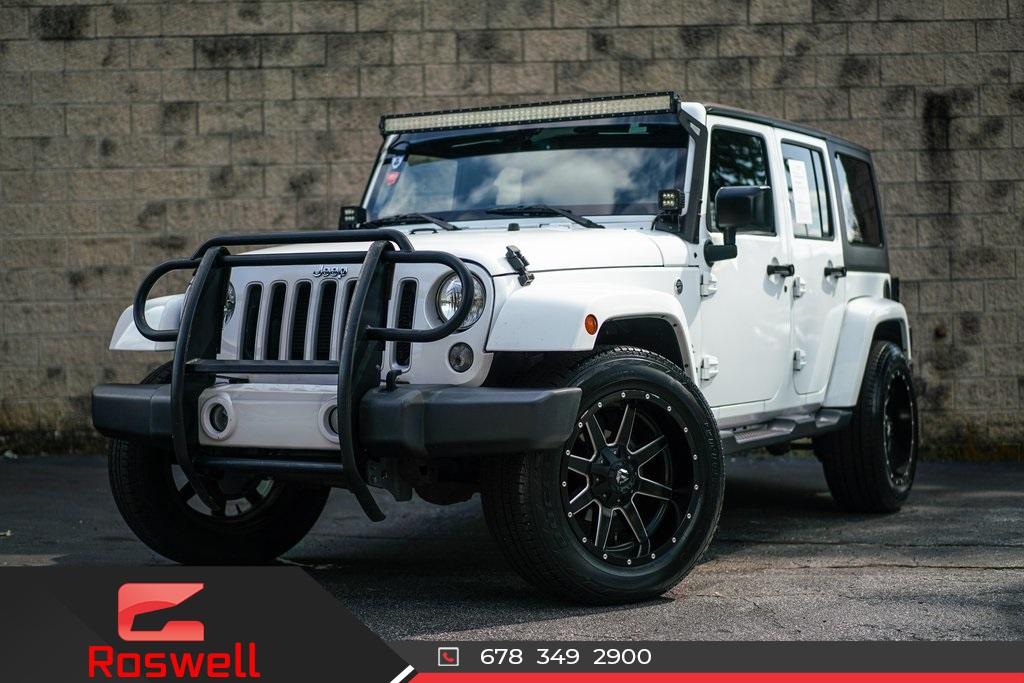 Used 2016 Jeep Wrangler Unlimited Sahara for sale $35,991 at Gravity Autos Roswell in Roswell GA 30076 1