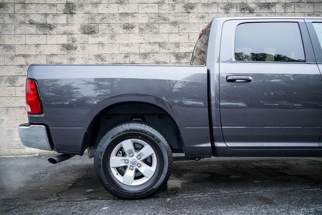 Used 2021 Ram 1500 Classic SLT for sale $37,981 at Gravity Autos Roswell in Roswell GA 30076 14