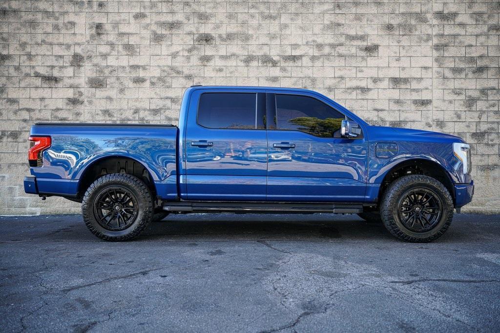 Used 2022 Ford F-150 Lightning Lariat for sale $84,992 at Gravity Autos Roswell in Roswell GA 30076 16